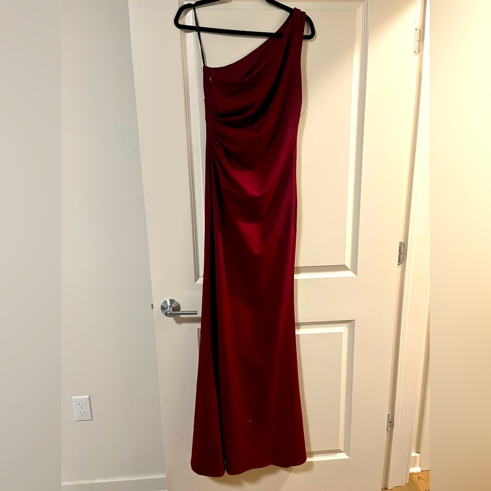 Brand new with tag. Burgundy long formal dress. Size 4